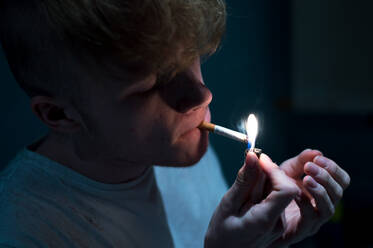 Close-Up Of Man Lighting Cigarette - EYF00199