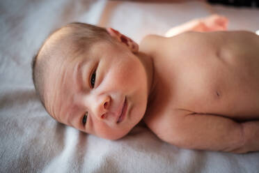 Close-Up Of Baby Boy On Bed At Home - EYF00302