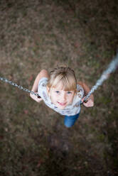 Portrait Of Cute Girl On Swing - EYF00311
