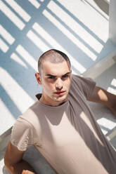 High Angle Portrait Of Young Man Looking On Steps - EYF00481