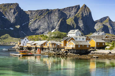 Fishing village on Reinefjorden, Saknesoya, Lofoten Islands, Norway, Scandinavia, Europe - RHPLF13913