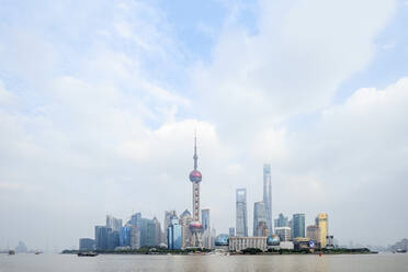 The Shanghai city skyline with the Oriental Pearl TV Tower, the Shanghai Tower and the Shanghai World Financial Center, Pudong, Shanghai, China, Asia - RHPLF14012