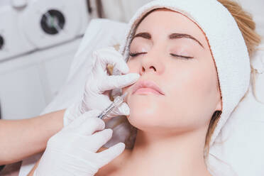 Cropped Image Of Surgeon Doing Anti Aging Therapy - EYF00649