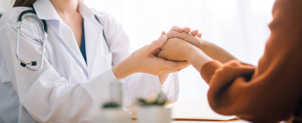 Doctor Holding Hands Of Patient - EYF00817