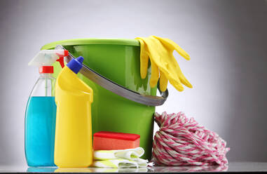 Close-Up Of Bucket With Cleaning Equipment On White Background - EYF00997