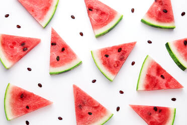 High Angle View Of Watermelon Slices Against White Background - EYF00998