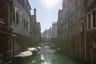 Italy, Venice, Sun shining over Venetian canal - MRAF00502