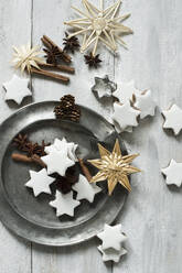 Star shaped cookies, cinnamon sticks, pine cones, cookie cutter, pewter plate, star anise and straw Christmas decorations - ASF06597