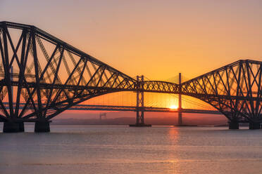UK, Scotland, Silhouettes of Forth Bridge and Forth Road Bridge at sunset - SMAF01856