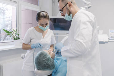 Young woman getting dental treatment in clinic - AHSF02042