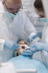 Young woman getting dental treatment in clinic - AHSF02046