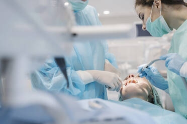 Young woman getting dental treatment in clinic - AHSF02052