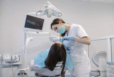 Young woman getting dental treatment in clinic - AHSF02056