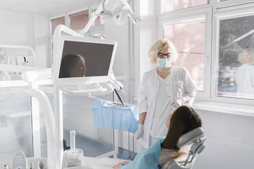 Young woman getting dental treatment in clinic - AHSF02071