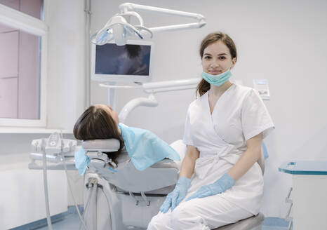 Young woman getting dental treatment in clinic - AHSF02089