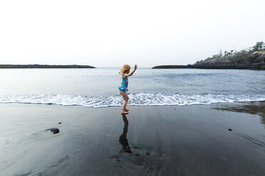 Girl playing at the seafront, Adeje, Tenerife, Canarian Islands, Spain - IHF00277