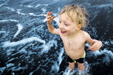 Boy playing at the seafront, Adeje, Tenerife, Canarian Islands, Spain - IHF00280