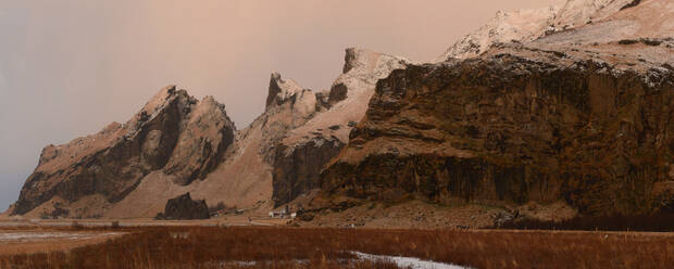 Panorama of mountain range and farm at sunrise, Iceland, Polar Regions - RHPLF14293