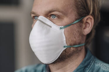 Portrait of man wearing protective mask - JOSEF00102