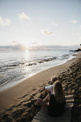 High angle view of friends sitting on beach during summer in Hawaii, Oahu, USA - LHPF01172