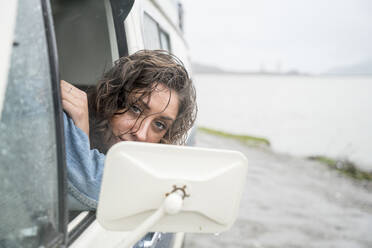 Portrait of teenage girl behind wheel of vintage van - CAVF77253