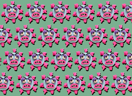 Rows of coronoa viruses with plasticine faces on green background - GEMF03496