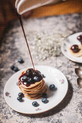 Chocolate Syrup Getting Poured On Cake In Plate - EYF01467