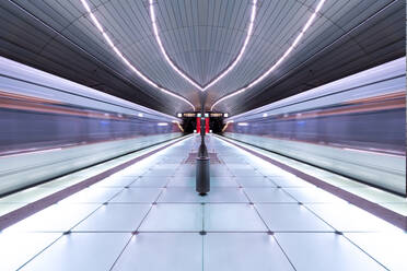 Diminishing Perspective Of Illuminated Railroad Station Platform - EYF01487