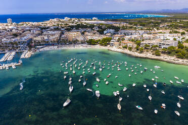 Spain, Balearic Islands, Colonia de Sant Jordi, Aerial view of large number of boats floating in water near shore of coastal town - AMF07926