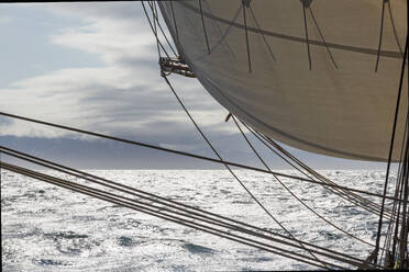 Sailboat sail and rigging over sunny Atlantic Ocean - HOXF05385