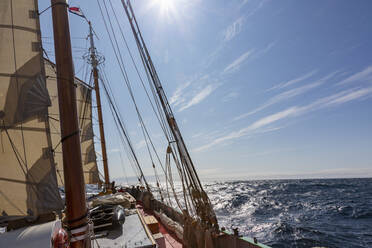 Sailboat on sunny blue Atlantic Ocean Greenland - HOXF05386