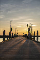 Denmark, Romo, Empty pier at sunset - ASCF01145