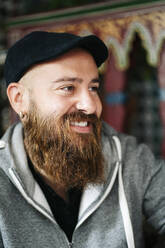 Portrait of bearded man in a tea shop - DGOF00553