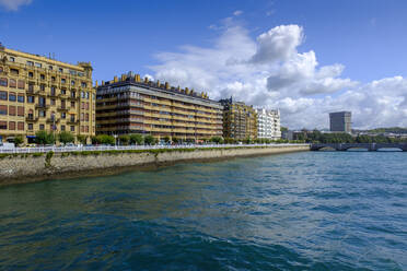 Spain, Gipuzkoa, San Sebastian, City buildings along bank of Urumea river - LBF02955