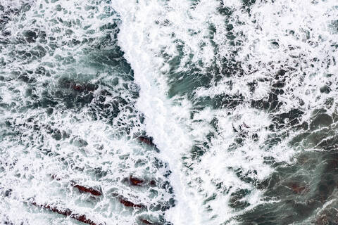 Spain, Biscay, Bilbao, Aerial view of ocean waves brushing against rocky coastline stock photo
