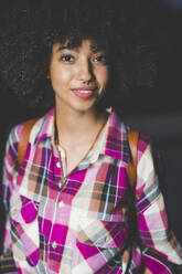 Portrait of smiling young woman with afro hairdo - MEUF00266