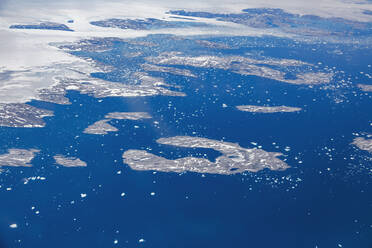 Greenland, East Greenland, Aerial view of Ammassalik island and fjord with  pack or drift ice stock photo