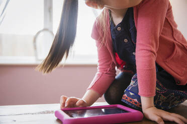 Girl using digital tablet - HOXF05904