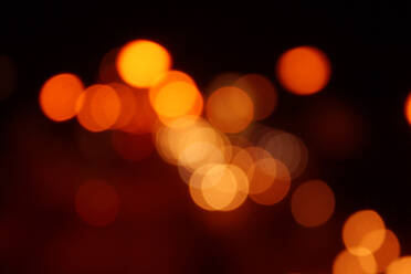 Defocused Image Of Illuminated Christmas Lights At Night - EYF01563