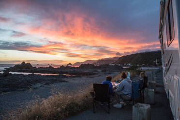 Friends On Road By Camper Van Against Sky During Sunset - EYF01595