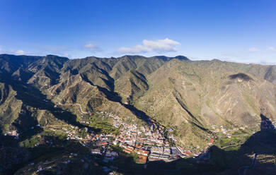 Spain, Province of Santa Cruz de Tenerife, Vallehermoso, Aerial view of town located in hilly valley of La Gomera island - SIEF09660