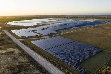 Germany, Mecklenburg-Western Pomerania, Luttow-Valluhn, Aerial view of solar power station at dusk - TEBF00039