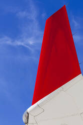 Airliner wing tip against a deep blue sky - CAVF77741