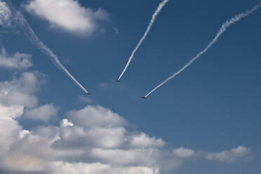 Military aircraft squadron flies into the distance in blue skies - CAVF77746