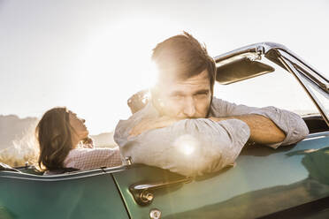 Couple in convertible car on a road trip - SDAHF00679