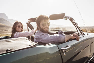 Couple in convertible car on a road trip - SDAHF00695