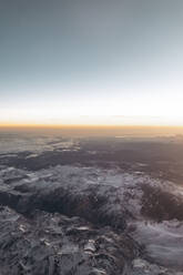 Finland, Aircraft view of snowcapped mountains at sunrise - AMAF00020