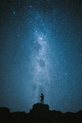 Low Angle View Of Silhouette Man Standing Against Star Field - EYF01913