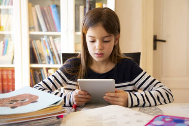 Girl doing homework with digital tablet - LVF08704