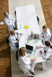 Female doctors having a meeting in conference room - BMOF00366